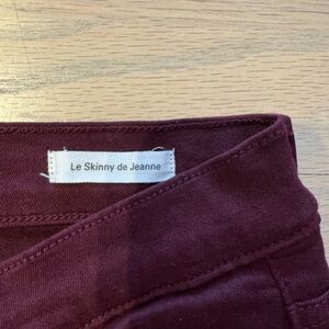 Frame denim Le Skinny de Jeanne jeans in wine/oxblood.